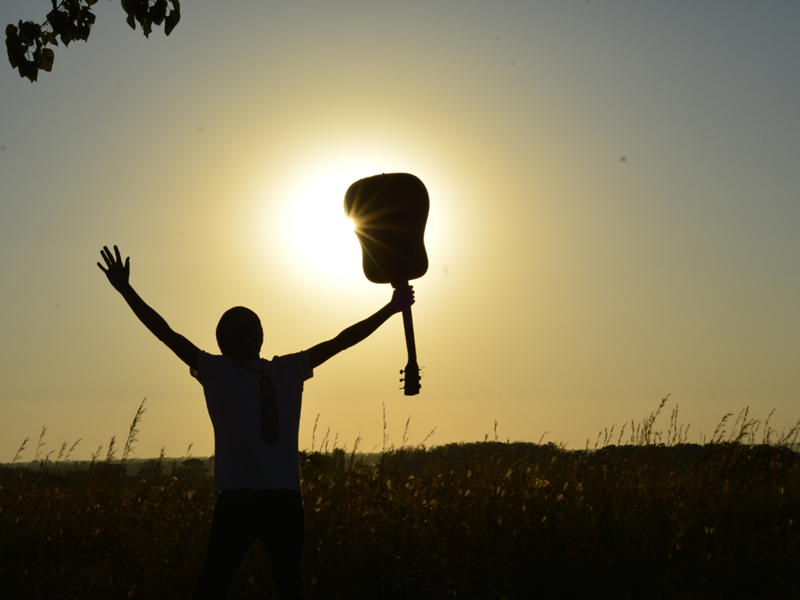 Youth holding instrument.